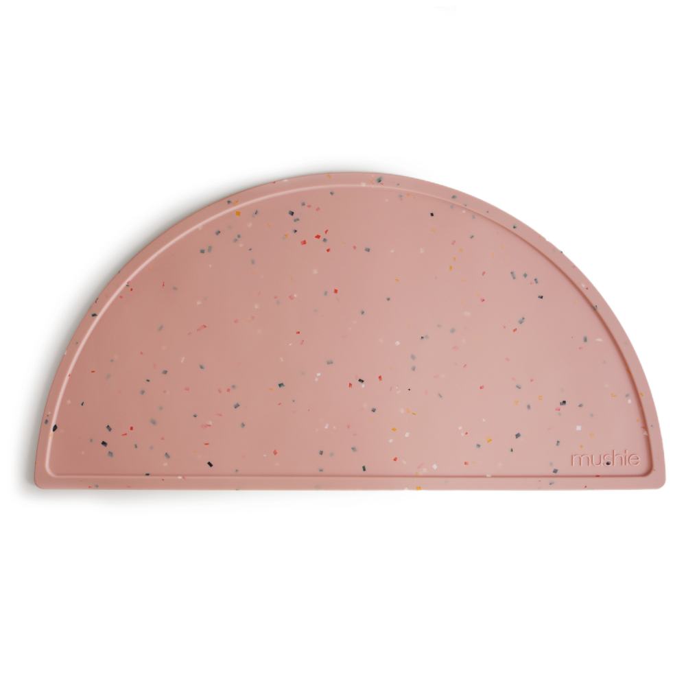 Mushie Baby Silicone Place Mat in a Charming Powder Pink Confetti Design
